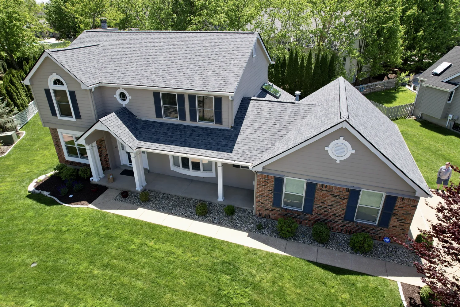 Aerial top-down view of a completed architectural-shingle roof replacement