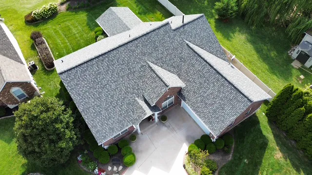 Finished shingle roof on a St. Louis home with a three-car garage