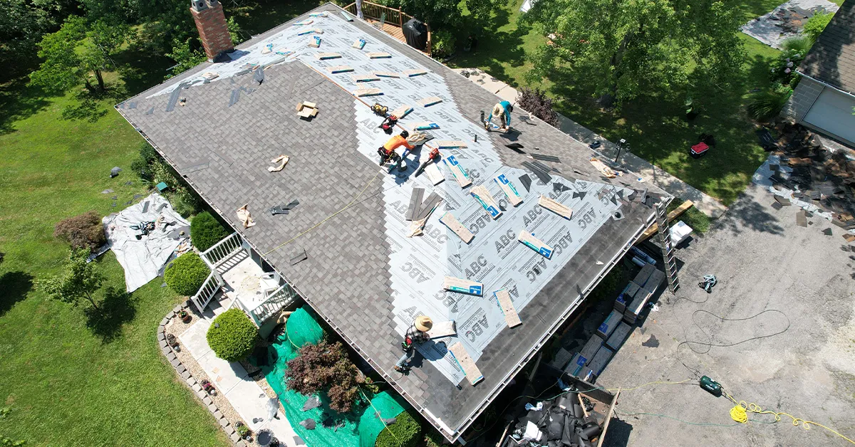 Loxley crew installing architectural shingles over synthetic underlayment
