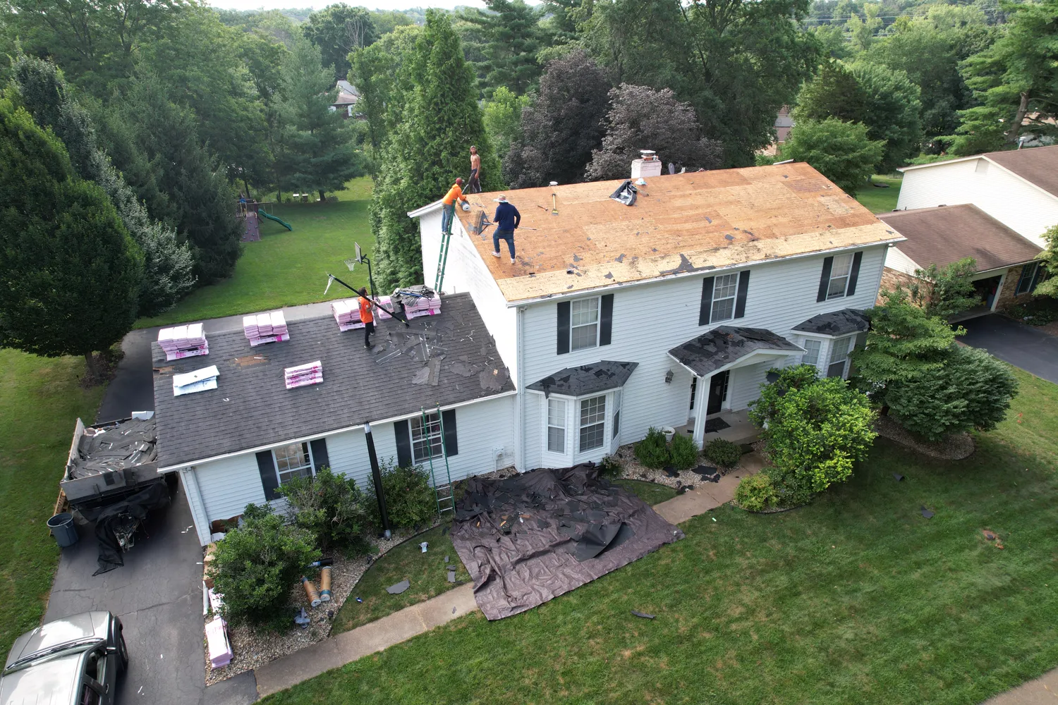 Roof tear-off with the deck exposed during a replacement