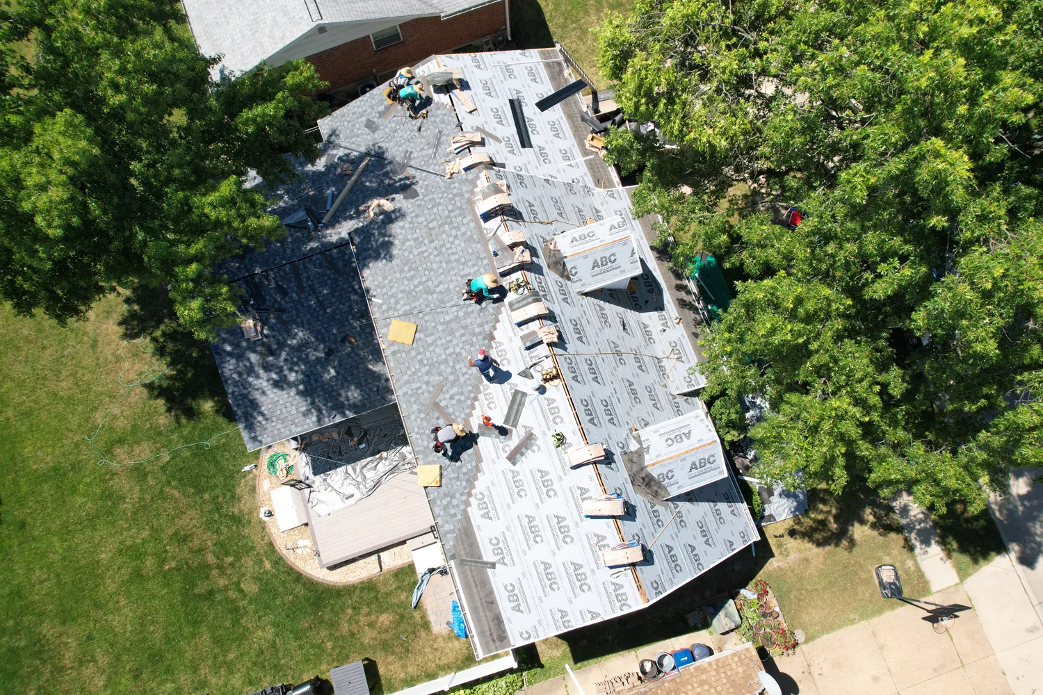 Synthetic underlayment installed over the deck before new shingles go on